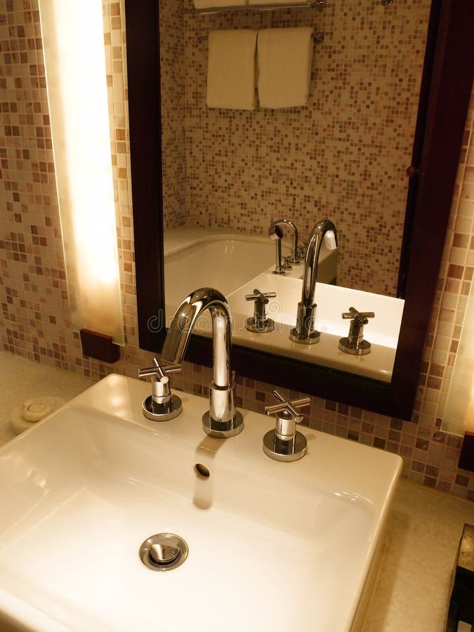 Hotel bathroom sink area stock image. Image of faucet 8663985