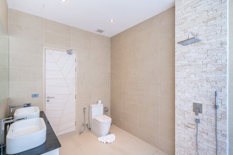 Luxury beautiful interior real bathroom features basin, toilet bowl in the house or home building royalty free stock image Luxury beautiful interior real bathroom features basin, toilet bowl in the house or home building royalty free stock image