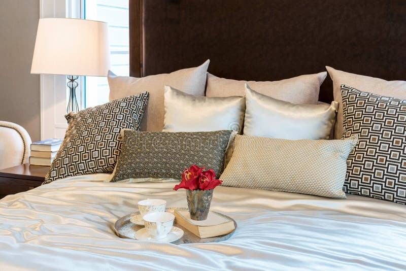Luxury Bedroom with Brown Pattern Pillows and Decorative Tray Stock