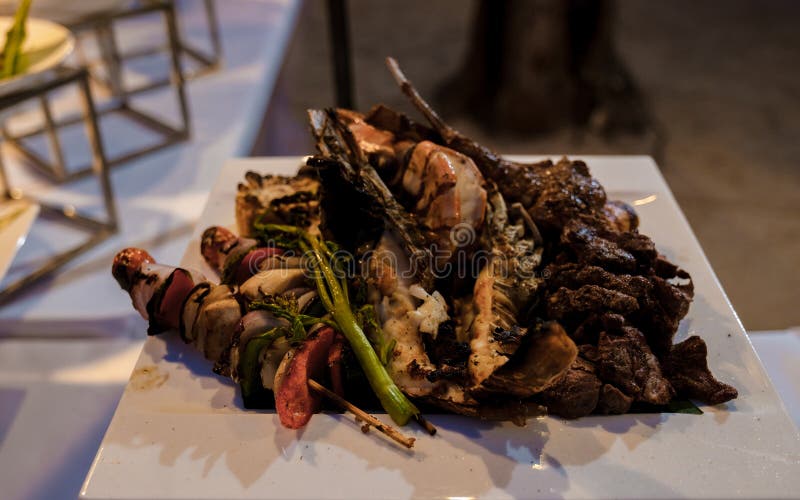 Luxury Dinner Table by the Ocean with Lobster, Fish and Thai Food Stock