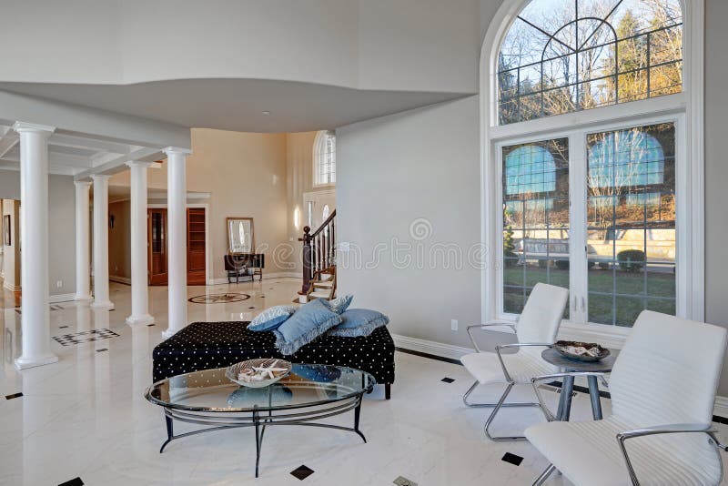 Luxury High Ceiling Living Room With Marble Floor Stock Photo