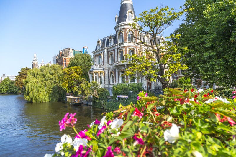 Luxury Home on Amsterdam Canal Stock Photo Image of willow, tree