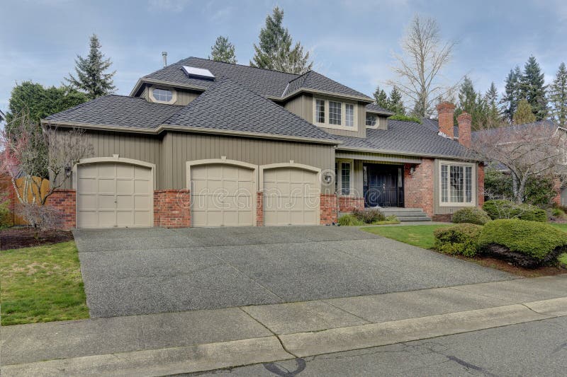Luxury home exterior with three car garage. royalty free stock image Luxury home exterior with three car garage. royalty free stock image