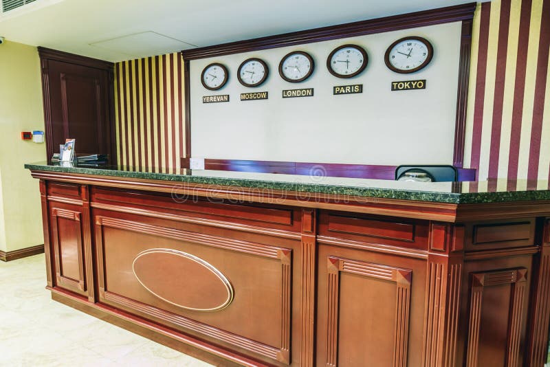 Luxury Hotel Reception with Clocks Showing the Time of Different