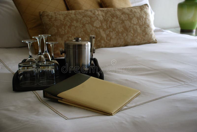 Luxury Hotel Room Bed with Drinks Tray and Menu