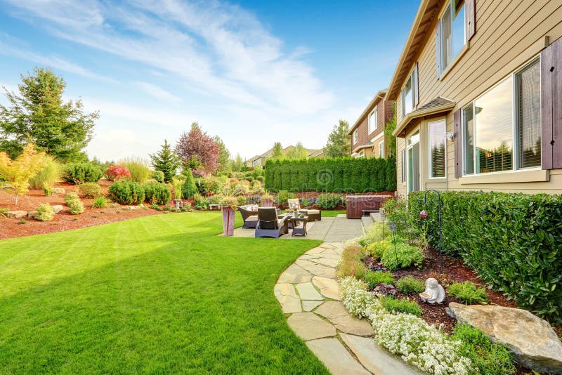 Luxury house exterior with impressive backyard landscape design