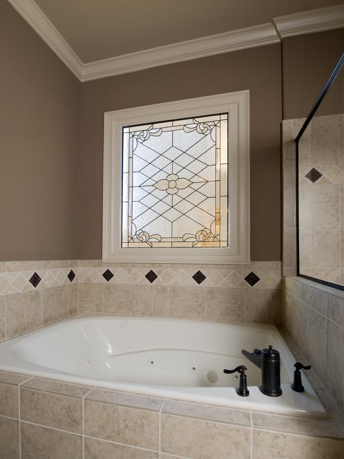 Luxury Jacuzzi and stained-glass window stock photography