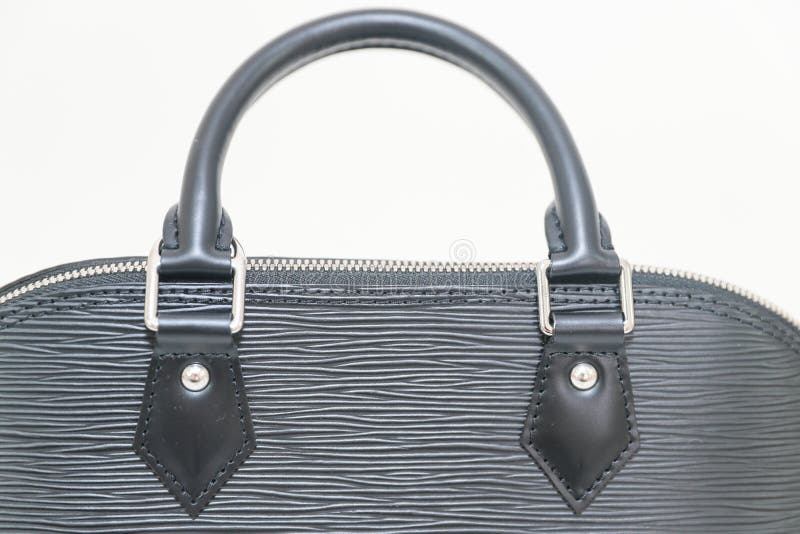 Luxury Louis Vuitton EPI ALMA PM black color handbag stock photos Luxury Louis Vuitton EPI ALMA PM black color handbag stock photos