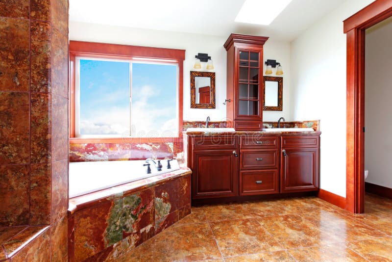 Luxury new home bathroom with red marble and mahogany wood. royalty free stock image Luxury new home bathroom with red marble and mahogany wood. royalty free stock image