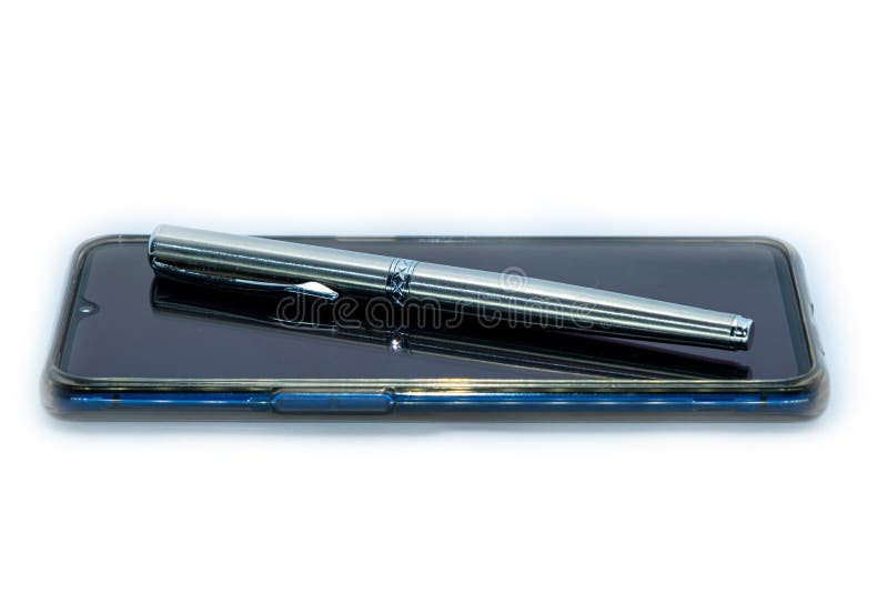Luxury pen on a smart phone on white Background. The luxury pen on a smart phone on white Background royalty free stock photo Luxury pen on a smart phone on white Background. The luxury pen on a smart phone on white Background royalty free stock photo