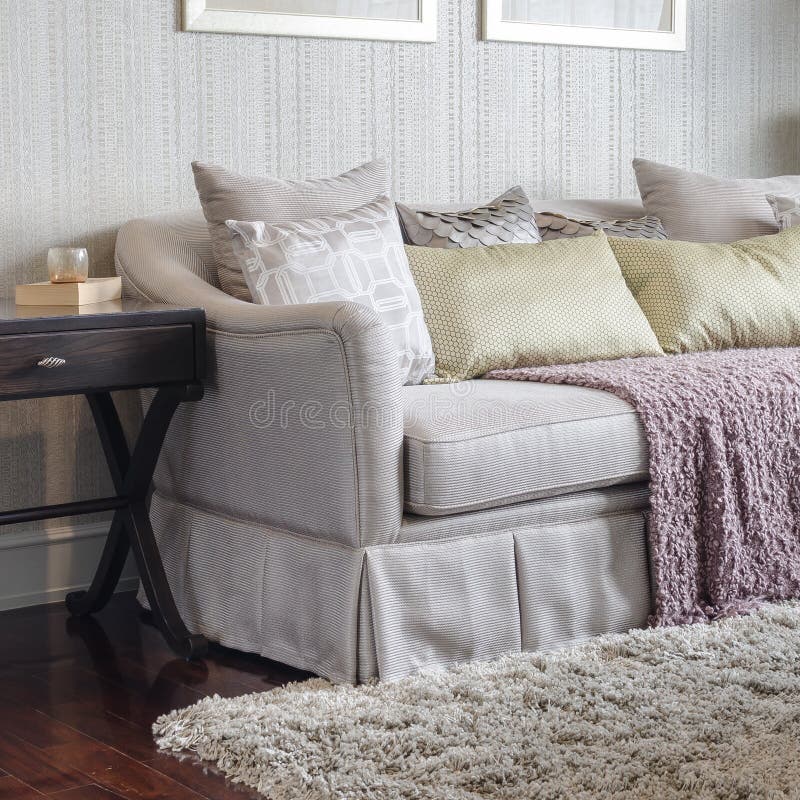 Luxury Sofa with Pillows and Red Blanket in Living Room Stock Photo