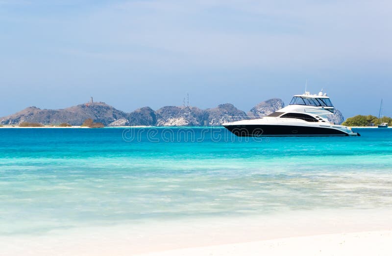 Luxury yacht by the beach stock photo Luxury yacht by the beach stock photo