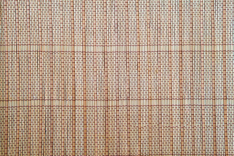 Luz - textura de bambu marrom do fundo da toalha de mesa da esteira fotos de stock royalty free Luz - textura de bambu marrom do fundo da toalha de mesa da esteira fotos de stock royalty free