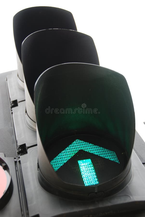 Close-up of green arrow traffic light as a metaphor for progress. Close-up of green arrow traffic light as a metaphor for progress