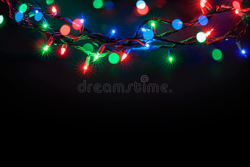 Luzes de Natal sobre o fundo preto imagens de stock royalty free Luzes de Natal sobre o fundo preto imagens de stock royalty free