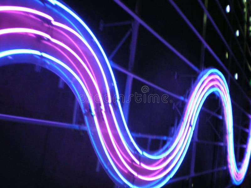 Swirling neon lights in blue pink. Swirling neon lights in blue pink