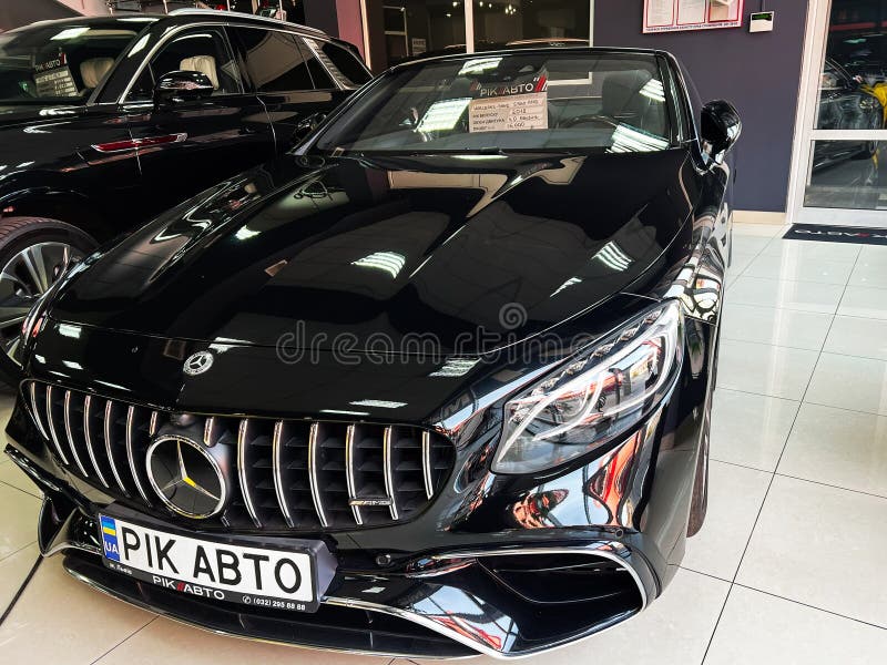 Lviv, Ukraine - February 12, 2025: Luxury black Mercedes-Benz S 560 AMG car in a showroom with modern automotive design royalty free stock photography