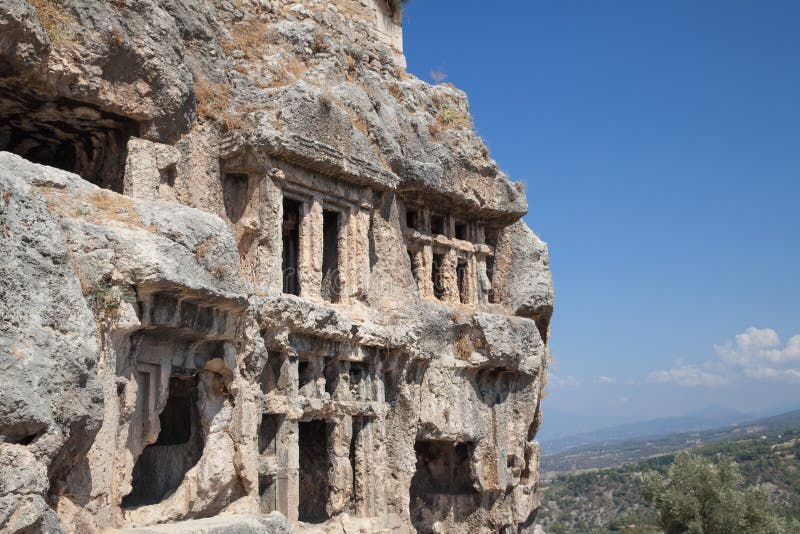 Tlos Antik Kenti, Türkiye konumunda Likya kaya mezarları.  Tlos antik kentinin kalıntıları.  4. yüzyıla kadar uzanan antik Likya kaya mezarlarının görünümü, telif ücretsiz stok fotoğraf