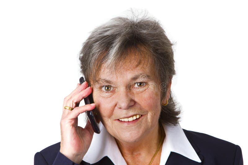 Lyckad kvinnligpensionär med mobiltelefon royaltyfri fotografi Lyckad kvinnligpensionär med mobiltelefon royaltyfri fotografi