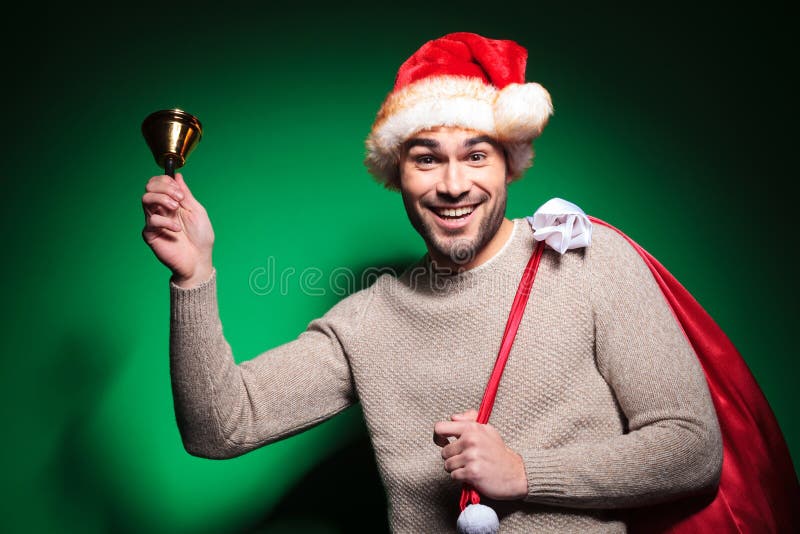 Lycklig santa man som ringer hans lilla klocka royaltyfria foton Lycklig santa man som ringer hans lilla klocka royaltyfria foton