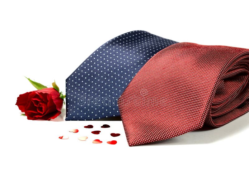 Happy Father's Day concept image with two smart generic business man's ties folded with hearts and a red rose against a white background. Copy space. Happy Father's Day concept image with two smart generic business man's ties folded with hearts and a red rose against a white background. Copy space.