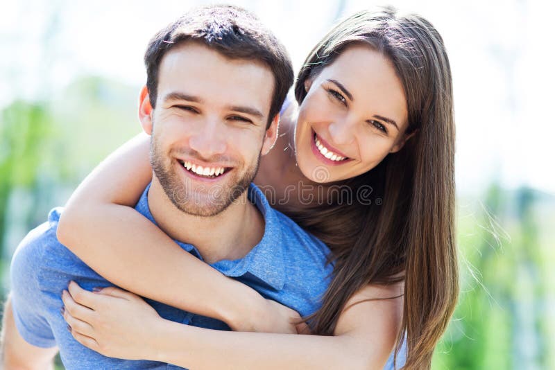 Happy young couple hugging outdoors. Happy young couple hugging outdoors