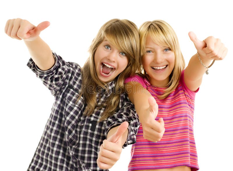 Portrait of happy teen girls showing thumbs up isolated one white. Portrait of happy teen girls showing thumbs up isolated one white