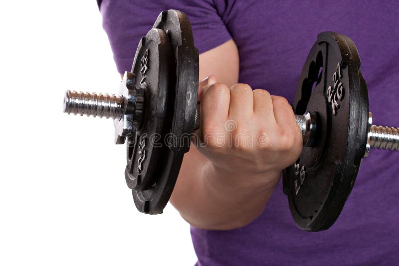 A young man lifting a dumbbell isolated over a white background. A young man lifting a dumbbell isolated over a white background.