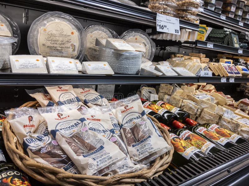 Angled view of a cheese and meat display in the deli section of a Town and Country grocer store. Angled view of a cheese and meat display in the deli section of a Town and Country grocer store