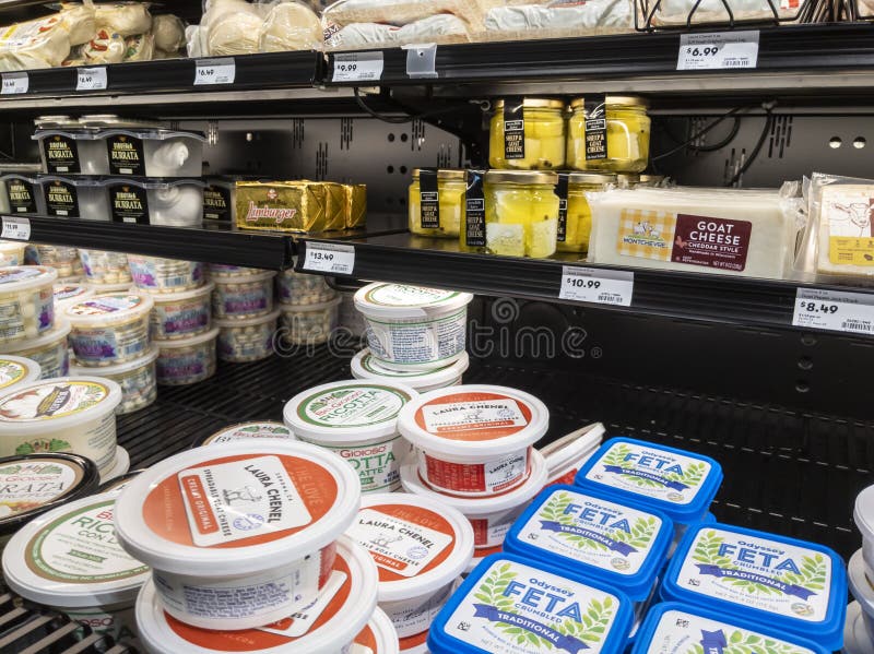 Angled view of a cheese display in the deli section of a Town and Country grocer store. Angled view of a cheese display in the deli section of a Town and Country grocer store