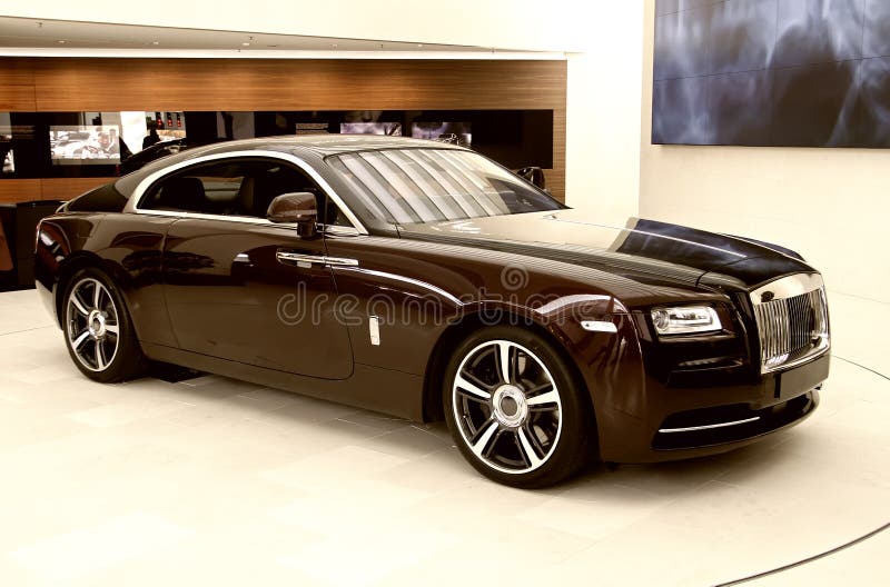 An absolute luxury car standing separated in the showroom. An absolute luxury car standing separated in the showroom