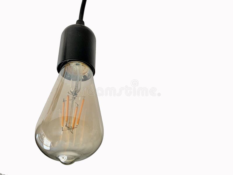 Lámpara de vidrio con espiral sobre fondo blanco La luz incandescente ilumina la habitación Bombilla de luz económica para decora foto de archivo libre de regalías Lámpara de vidrio con espiral sobre fondo blanco La luz incandescente ilumina la habitación Bombilla de luz económica para decora foto de archivo libre de regalías