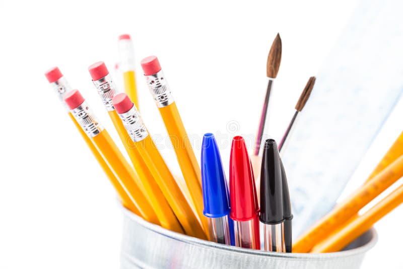 Bunch of pencils and pen in a metal pot, isolated on white background. Bunch of pencils and pen in a metal pot, isolated on white background.