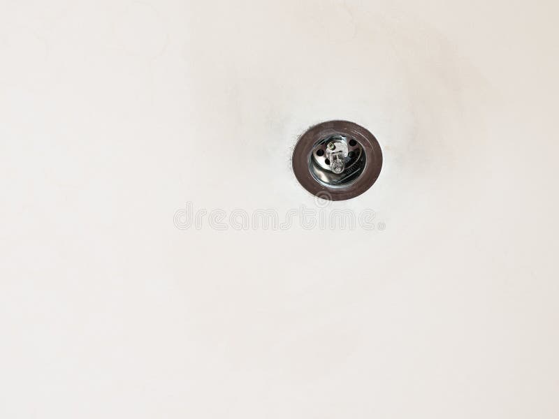 Used halogen lamp mounted in old plasterboard false ceiling. Used halogen lamp mounted in old plasterboard false ceiling