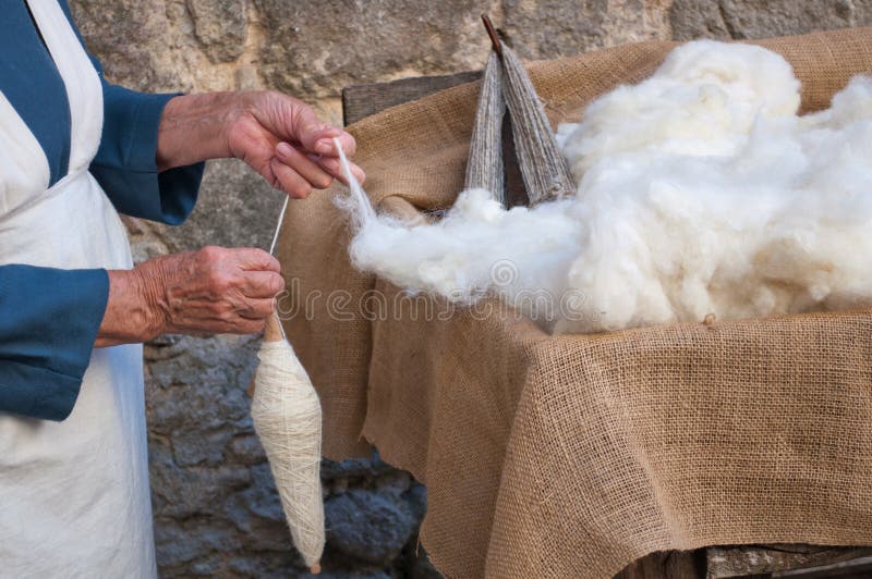 Crafts Wool Spinning, old woman at work. Crafts Wool Spinning, old woman at work