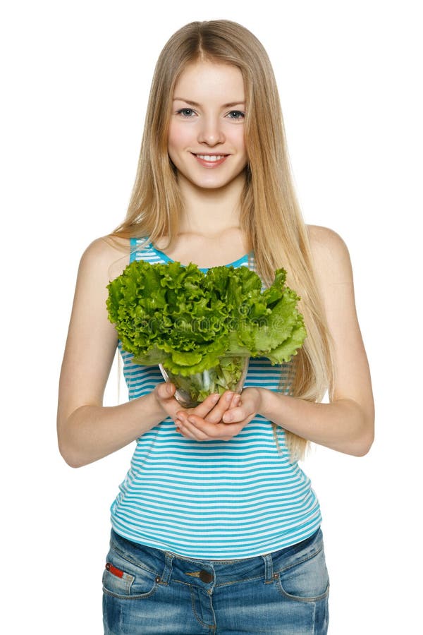Lächelnde Frau, die Kopfsalat hält stockfotografie Lächelnde Frau, die Kopfsalat hält stockfotografie