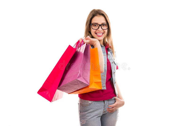 Lächelnde Frau mit Einkaufenbeuteln lizenzfreies stockbild Lächelnde Frau mit Einkaufenbeuteln lizenzfreies stockbild