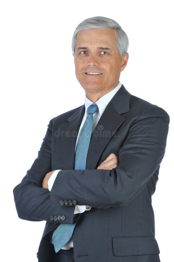 Lächelnder Geschäftsmann mit den Armen gefaltet lizenzfreies stockbild Lächelnder Geschäftsmann mit den Armen gefaltet lizenzfreies stockbild