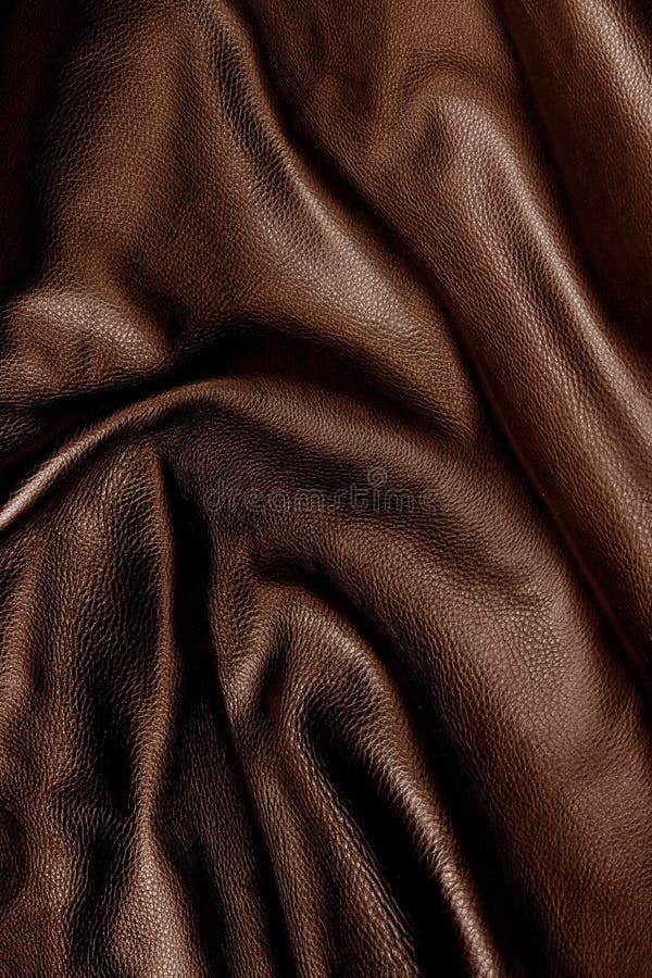 Closeup of the details and texture of rich, shiny, dark brown leather. Closeup of the details and texture of rich, shiny, dark brown leather.