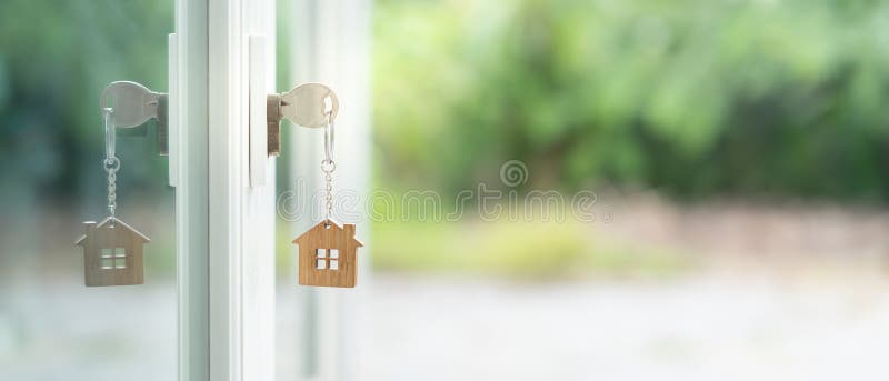 Landlord key for unlocking house is plugged into the door. Second hand house for rent and sale. keychain is blowing in the wind. mortgage for new home, buy, sell, renovate, investment, owner, estate. Landlord key for unlocking house is plugged into the door. Second hand house for rent and sale. keychain is blowing in the wind. mortgage for new home, buy, sell, renovate, investment, owner, estate