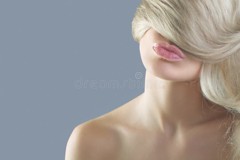 Woman with long hair blonde in sensual lips. Woman with long hair blonde in sensual lips.