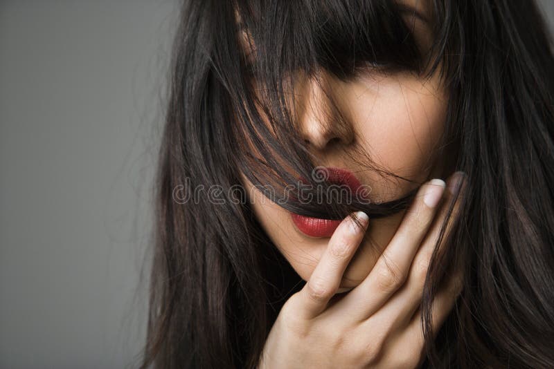 Headshot of pretty young woman with long black hair. Headshot of pretty young woman with long black hair.