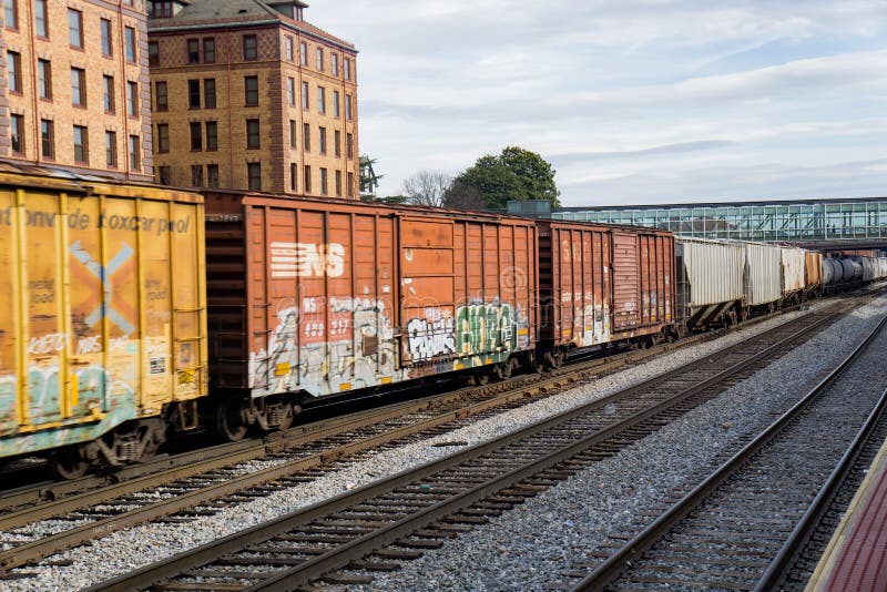 Roanoke, VA – November 27th: Norfolk and Southern transporting over a mile long railcars through downtown Roanoke, Virginia, USA on November 28th, 2017, Roanoke, Virginia, USA. Roanoke, VA – November 27th: Norfolk and Southern transporting over a mile long railcars through downtown Roanoke, Virginia, USA on November 28th, 2017, Roanoke, Virginia, USA