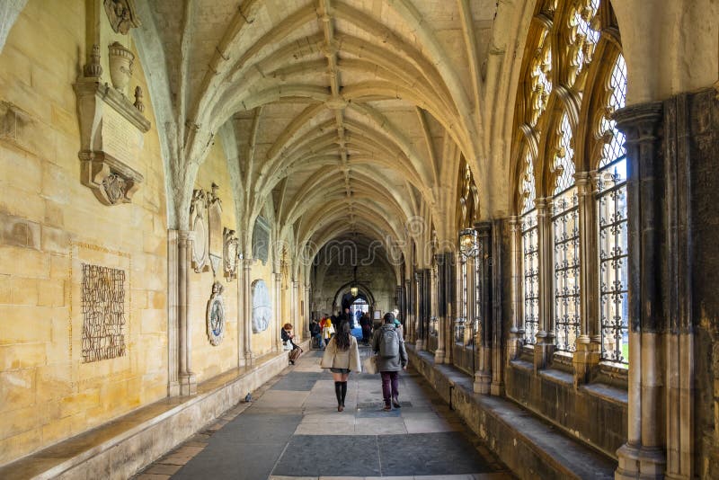 London, England / United Kingdom - 2019/01/28: Cloisters of the royal Westminster Abbey, formally Collegiate Church of St. Peter at Westminster with the Victoria Tower of the Houses of Parliament in background. London, England / United Kingdom - 2019/01/28: Cloisters of the royal Westminster Abbey, formally Collegiate Church of St. Peter at Westminster with the Victoria Tower of the Houses of Parliament in background