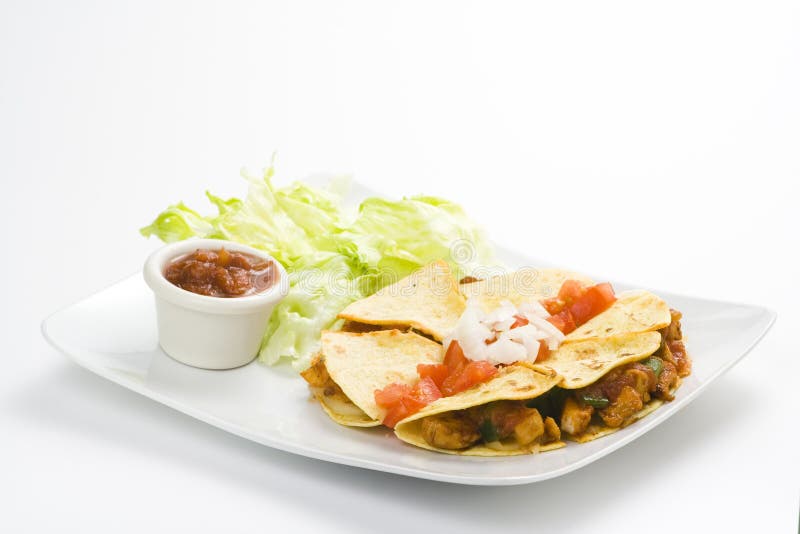 Delicious chicken quesadilla and fresh vegetables isolated. Delicious chicken quesadilla and fresh vegetables isolated