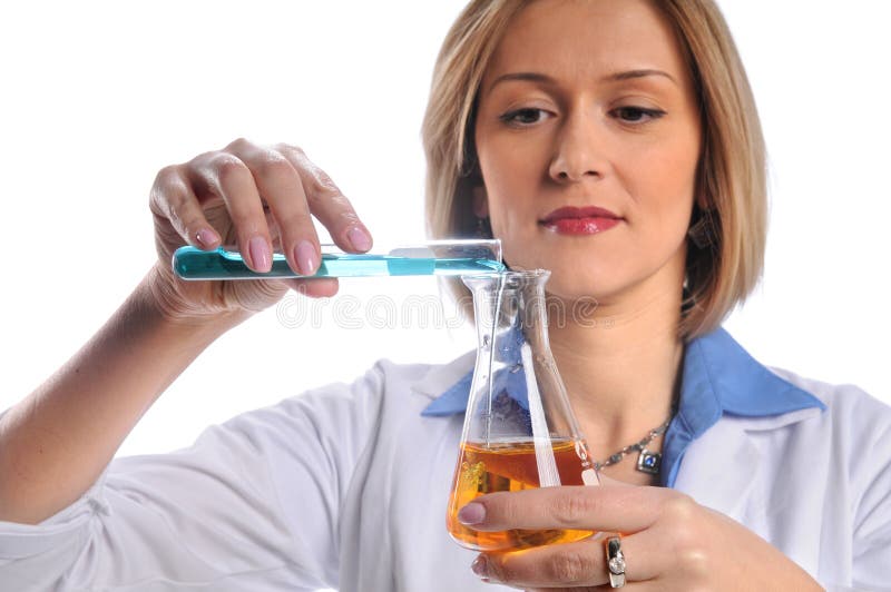 Female lab tech mixing liquids from test tube and flask. Female lab tech mixing liquids from test tube and flask
