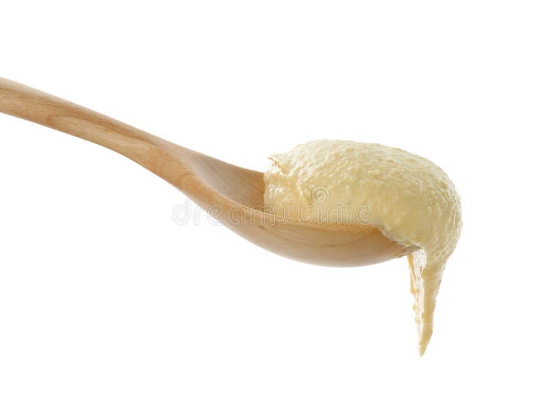 Löffel mit köstlichem Hummus isoliert auf weiß lizenzfreie stockfotos