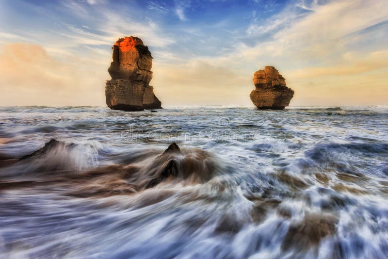 2 limestone apostles off Gibson steps beach at Twelve apostles marine park during sunrise sunlight. 2 limestone apostles off Gibson steps beach at Twelve apostles marine park during sunrise sunlight.