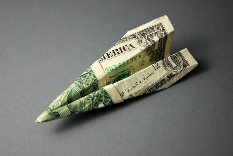 A paper plane made from an American $1 bill. A paper plane made from an American $1 bill.