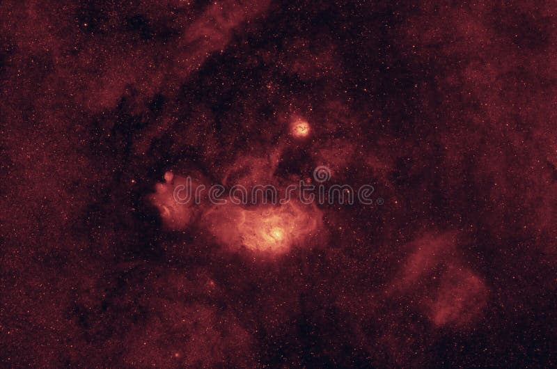 M8 Lagoon and M20 Trifid hydrogen emission nebulas in Sagittarius constellation. Narrowband hydrogen-alpha image.